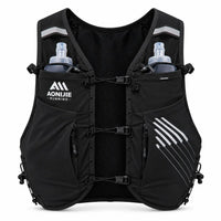 sac trail 10L porte baton de couleur noir vue de face avec 2 flasques dans chaque poches 