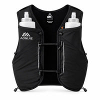 sac ultra trail 12L de couleur noir vue de face avec 2 flasques dans les poches 